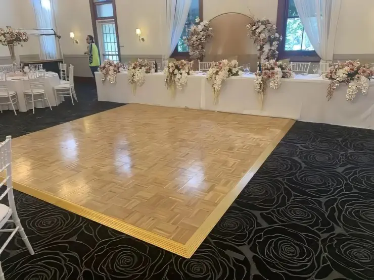 Parquetry dance floor set up for an indoor event